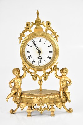 Lot 1277 - A French gilt brass eight day mantel clock,...