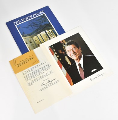 Lot 2195 - RONALD REAGAN; a signed colour head and...
