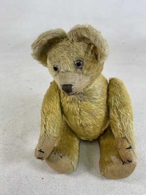 Lot 69 - A large vintage teddy bear with glass eyes,...