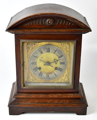 Lot 116 - An oak cased mantel clock, the dial set with...