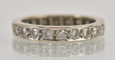 Lot 1222 - An 18ct white gold diamond full eternity ring,...