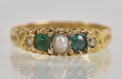 Lot 1260 - A 15ct yellow gold emerald and seed pearl set...