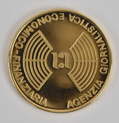 Lot 1473 - INTERCOINS; a commemorative 18ct yellow gold...