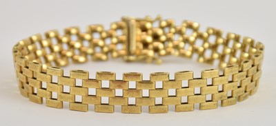 Lot 1404 - An 18ct yellow gold flat link bracelet, length...