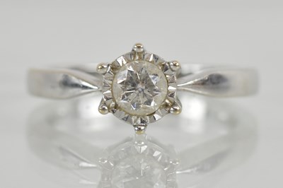 Lot 1218 - An 18ct white gold diamond solitaire ring, the...