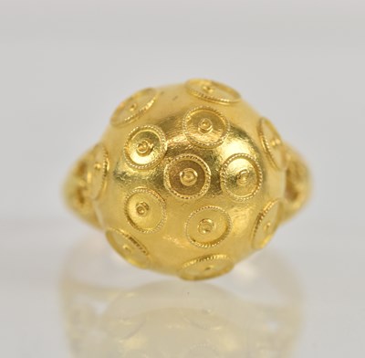Lot 1232 - An Indian yellow metal dress ring with pierced...