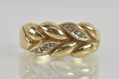 Lot 1258 - A 9ct yellow gold florally decorated diamond...