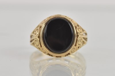 Lot 1267 - A 9ct yellow gold onyx set signet ring, size L,...