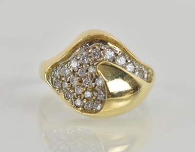 Lot 1219 - An 18ct yellow gold pavé diamond set ring of...