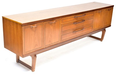 Lot 3 - BEAUTILITY FURNITURE; a vintage teak long...