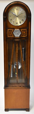 Lot 99 - A mid-century oak cased longcase clock with...