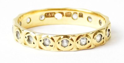 Lot 670 - An 18ct yellow gold eternity ring set with...