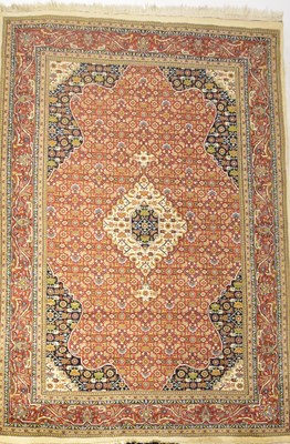Lot 105 - A Persian Tabriz woollen Rug, with central...