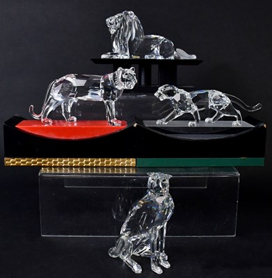 Lot 216 - SWAROVSKI: four crystal models of big cats,...