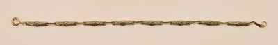 Lot 1469 - A 9ct yellow gold bracelet with Mackintosh...