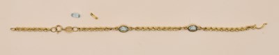 Lot 1475 - A 9ct yellow gold bracelet, with rope twist...
