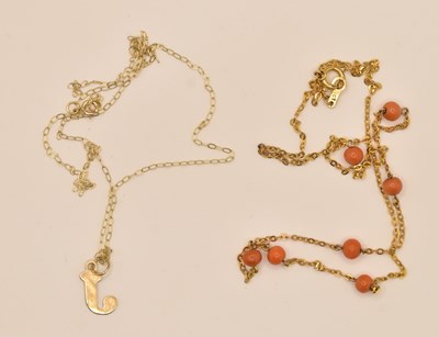 Lot 1400 - A 9ct gold coral bead necklace, on a 9ct gold...