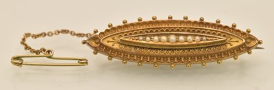 Lot 1434 - A Victorian 15ct yellow gold oval brooch, with...