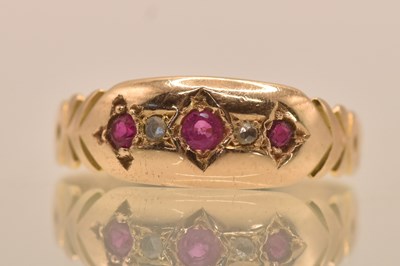 Lot 1309 - A 15ct yellow gold diamond and ruby set ring,...