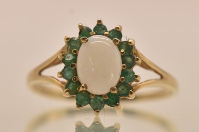 Lot 1311 - A 9ct yellow gold opal and green stone set...