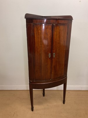 Lot 551 - A 19th century mahogany corner cabinet with...