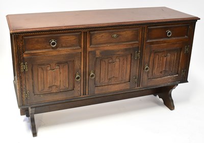 Lot 16 - A Jaycee Furniture Ltd carved oak sideboard...