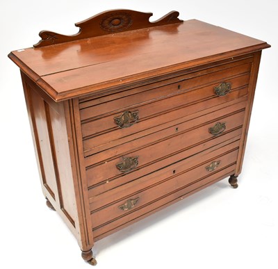 Lot 65 - An Edwardian walnut chest of three long...