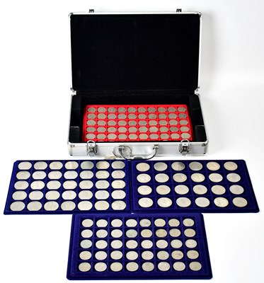 Lot 612 - A coin collector's case containing four trays...