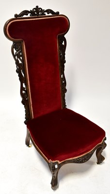 Lot 69 - A Victorian walnut prie dieu with carved...