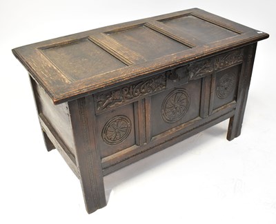 Lot 29 - An oak coffer with panelled top, with candle...