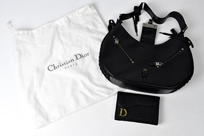 Lot 317 - CHRISTIAN DIOR; a black leather handbag with...