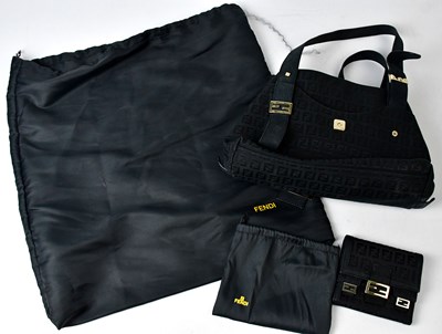 Lot 318 - FENDI; a handbag with all over Fendi logo,...