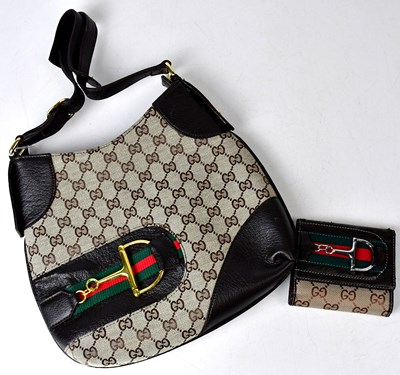 Lot 316 - GUCCI; a brown canvas Hasler horse bit hobo...