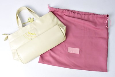 Lot 313 - RADLEY; a cream leather handbag with coloured...