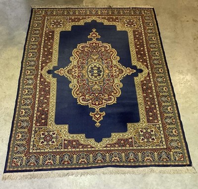 Lot 441 - A machine woven Eastern style rug, with deep...