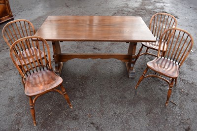 Lot 1724 - A reproduction oak rectangular dining table