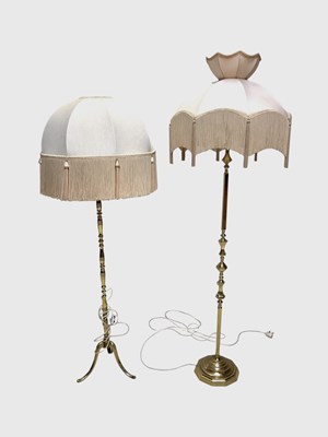 Lot 1304 - Two brass standard lamps and shades, one with...
