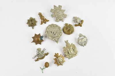 Lot 556 - Eleven military badges, to include a Tank...