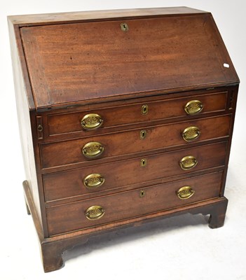 Lot 91 - A George III oak bureau with fall front and...