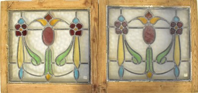 Lot 103 - A pair of Art Nouveau leaded stained-glass...