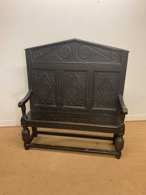 Lot 467 - A Victorian carved dark oak high back settle,...