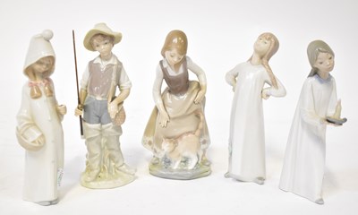 Lot 132 - LLADRO; five figures of children, a boy with...