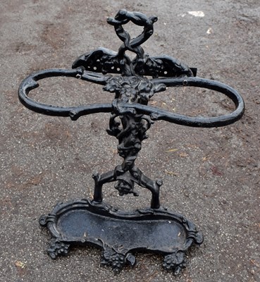 Lot 1552 - A black painted cast iron stick stand