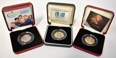 Lot 627 - THE ROYAL MINT; three silver proof 50p coins...