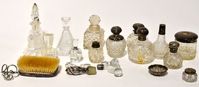 Lot 566 - A collection of glass dressing table jars,...