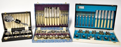 Lot 554 - Three cased sets of silver-plated cutlery,...