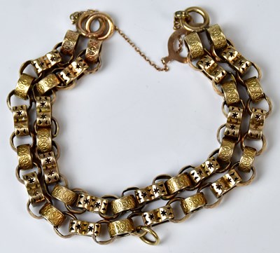 Lot 804 - A yellow metal double chain link bracelet, the...