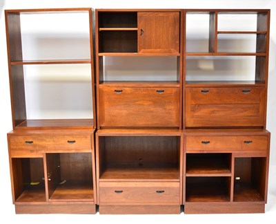 Lot 10 - A mid-century teak modular three-piece wall...