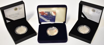 Lot 638 - THE ROYAL MINT; two silver proof £5 coins, the...