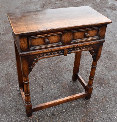 Lot 1744 - A small reproduction oak single drawer hall table